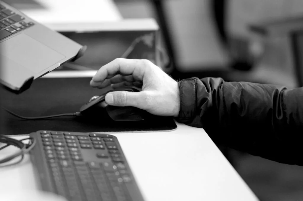 working at a desk with a computer at Kings Digital.